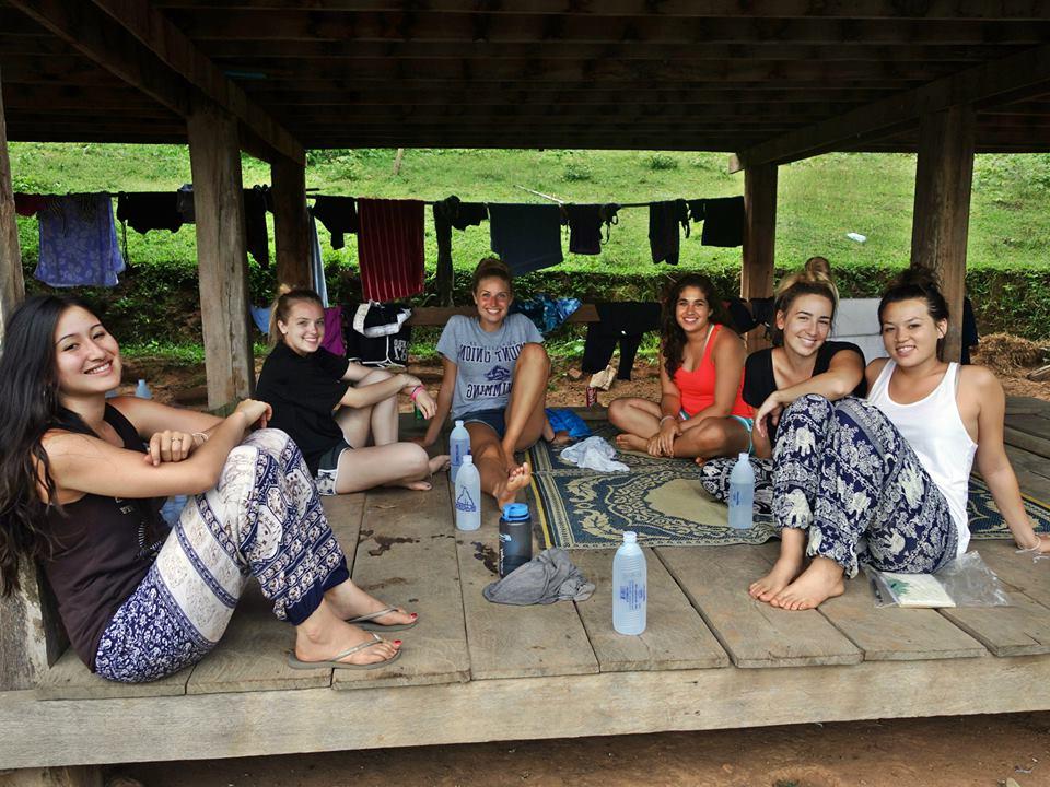 Groups of students with Thai women in rural village